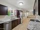 View of a kitchen with granite countertops and stainless steel appliances at 1306 W 12Th St, Tempe, AZ 85281