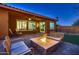 An outdoor area featuring a fire pit with seating, an entertainment area, and a beautiful view at 13145 W Whisper Rock Trl, Peoria, AZ 85383
