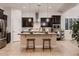 Updated kitchen with a granite island, stainless steel appliances, and designer finishes at 13145 W Whisper Rock Trl, Peoria, AZ 85383