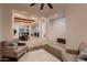 Spacious open layout with tile and wood flooring, leading to the dining and living areas at 13145 W Whisper Rock Trl, Peoria, AZ 85383