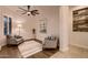 Bright sitting room with plantation shutters, two comfortable armchairs, and elegant decor at 13145 W Whisper Rock Trl, Peoria, AZ 85383
