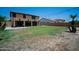 Large backyard with a covered patio, solar panels, string lights and privacy at 13601 W Hearn Rd, Surprise, AZ 85379