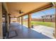 View of the covered patio, complete with string lights, ceiling fans, and a view of the backyard at 13601 W Hearn Rd, Surprise, AZ 85379