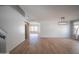 Open living space showcasing wood-look flooring, modern lighting, and seamless transition to other areas at 13601 W Hearn Rd, Surprise, AZ 85379