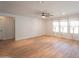 Bright living room with neutral walls, ceiling fan, recessed lighting, and wood-look flooring at 13601 W Hearn Rd, Surprise, AZ 85379