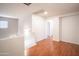 Bright upstairs loft area featuring hardwood flooring and neutral walls with ample natural light at 13601 W Hearn Rd, Surprise, AZ 85379