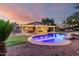 Backyard with an in-ground pool and outdoor living space at 14687 W Amelia Ave, Goodyear, AZ 85395