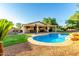 Wide angle shot of the backyard showing the covered patio and pool at 14687 W Amelia Ave, Goodyear, AZ 85395