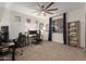 This office/bedroom has great natural light, ceiling fan, and ample space for work or rest at 14687 W Amelia Ave, Goodyear, AZ 85395