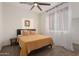 Inviting bedroom offers soft lighting, neutral decor, and comfortable furnishings, creating a serene atmosphere at 14687 W Amelia Ave, Goodyear, AZ 85395