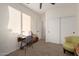 Bright bedroom with a large closet, work space and natural light at 14687 W Amelia Ave, Goodyear, AZ 85395