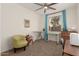 Craft bedroom has a nice area for designing, sewing, or work space at 14687 W Amelia Ave, Goodyear, AZ 85395