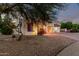 Charming single-story home with desert landscaping and mature trees in a quiet neighborhood at 14687 W Amelia Ave, Goodyear, AZ 85395