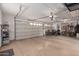 Spacious garage with room for cars, motorcycles and extra storage at 14687 W Amelia Ave, Goodyear, AZ 85395