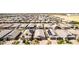 Picture showcasing a residential area filled with neutral-toned houses and desert landscaping at 15078 W Mckinley St, Goodyear, AZ 85338