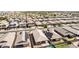 View of a residential neighborhood featuring neutral-toned homes, streets and backyard pools at 15078 W Mckinley St, Goodyear, AZ 85338