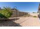 Paver patio with greenery and block wall in a private backyard at 15078 W Mckinley St, Goodyear, AZ 85338