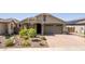 Charming single-Gathering home with a well-maintained front yard and a paved driveway at 15078 W Mckinley St, Goodyear, AZ 85338
