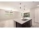 Open-concept kitchen featuring an island and views of the spacious living room at 15078 W Mckinley St, Goodyear, AZ 85338