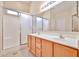 Bright bathroom featuring a double sink vanity and a shower with sliding glass doors at 16126 N 159Th Dr, Surprise, AZ 85374