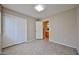 Cozy bedroom with tile flooring, closet space and a view of an ensuite bathroom at 16126 N 159Th Dr, Surprise, AZ 85374
