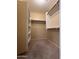 Spacious walk-in closet featuring shelving and hanging racks for efficient organization at 16126 N 159Th Dr, Surprise, AZ 85374