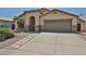 Inviting single-Gathering home with a two-car garage, desert landscaping, and a tile roof at 16126 N 159Th Dr, Surprise, AZ 85374