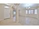 Bright and airy foyer with tile flooring, archways, and a view of the living spaces at 16126 N 159Th Dr, Surprise, AZ 85374