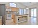 Spacious kitchen featuring granite countertops, island and a white range at 16126 N 159Th Dr, Surprise, AZ 85374
