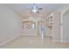 Bright, spacious living room with laminate flooring, built-in shelving and open layout with archways at 16126 N 159Th Dr, Surprise, AZ 85374
