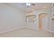 Spacious living room featuring a decorative wall inset and modern ceiling fan at 16126 N 159Th Dr, Surprise, AZ 85374