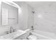 Bright bathroom featuring new fixtures, a white vanity, and a shower over a tub with white marble tiling at 1631 E Newport Dr, Tempe, AZ 85282