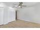 Bedroom featuring a closet, light-colored walls, and wood-look flooring at 1631 E Newport Dr, Tempe, AZ 85282