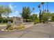 Community sign for Park Riviera, with lush trees, mature cactus, and an inviting entrance at 1631 E Newport Dr, Tempe, AZ 85282