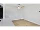 Cozy dining area with updated ceiling fan, light floors, and a view of the kitchen at 1631 E Newport Dr, Tempe, AZ 85282