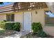Close up of front entrance with security door, manicured bushes and desert landscaping at 1631 E Newport Dr, Tempe, AZ 85282