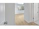 Bright hallway leads into the living space, featuring light wood flooring and neutral paint at 1631 E Newport Dr, Tempe, AZ 85282