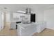 Modern kitchen with white cabinetry, stainless steel appliances, and sleek countertops at 1631 E Newport Dr, Tempe, AZ 85282