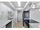 Updated kitchen with light cabinets, stainless appliances, and light countertops at 1631 E Newport Dr, Tempe, AZ 85282