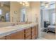 Bathroom features a tiled double vanity and is accessible from an adjacent bedroom at 16425 S 34Th St, Phoenix, AZ 85048