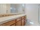 Bathroom featuring a sink and vanity with tiled countertop, a toilet, and glass shower at 16425 S 34Th St, Phoenix, AZ 85048