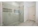 Bright glass shower with neutral tile surround and multiple shower heads at 16425 S 34Th St, Phoenix, AZ 85048