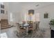 Dining room with natural light and a modern chandelier above the table for Gathering meals at 16425 S 34Th St, Phoenix, AZ 85048
