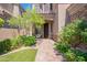 Inviting front entrance with brick pathway and lush landscaping creates a welcoming ambiance at 16425 S 34Th St, Phoenix, AZ 85048