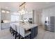 Bright kitchen features a huge center island and stainless steel appliances for meal prep at 16425 S 34Th St, Phoenix, AZ 85048