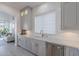 Bright kitchen area with lots of natural light, modern countertops, and stainless steel appliances at 16425 S 34Th St, Phoenix, AZ 85048