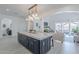 Spacious kitchen features a large island with barstool seating, with an open flow into the living room at 16425 S 34Th St, Phoenix, AZ 85048