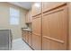 A view of the laundry room with storage, sink, washer, and dryer at 16425 S 34Th St, Phoenix, AZ 85048