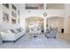 Bright living room features soaring ceilings, and comfortable seating with an open flow to the kitchen at 16425 S 34Th St, Phoenix, AZ 85048