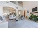Open concept living room with light gray kitchen with island and bar stool seating at 16425 S 34Th St, Phoenix, AZ 85048
